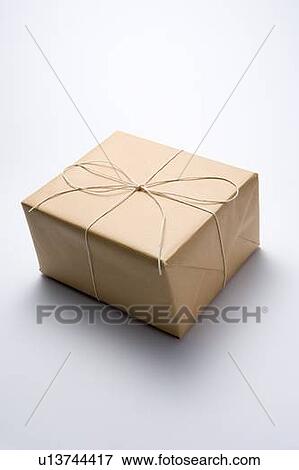 Package Wrapped In Brown Paper View Large Photo Image Stock Photo - Package Wrapped In Brown Paper. Fotosearch