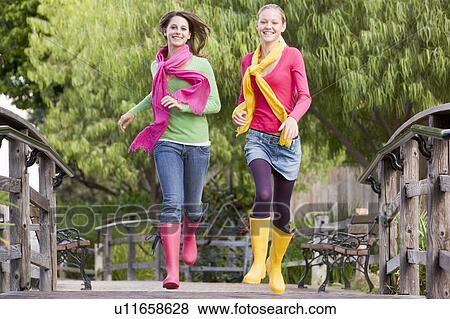 Pair Of Teenage Girls Jogging In Park View Large Photo Image Stock Photo - Pair Of Teenage Girls Jogging In Park . Fotosearch