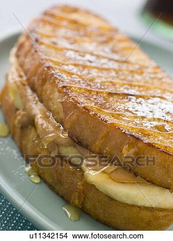 Peanut Butter And Banana Eggy Bread Sandwich With Syrup View Large Photo Image Picture - Peanut Butter And Banana Eggy Bread Sandwich With Syrup. Fotosearch