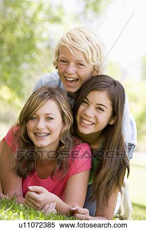 Stock Photography - Portrait Of Brother And Sisters. Fotosearch