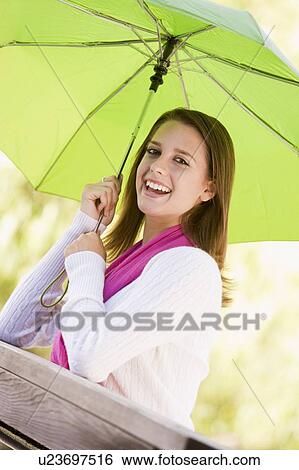 Stock Photograph - Portrait Of Teenage Girl Outdoors . Fotosearch