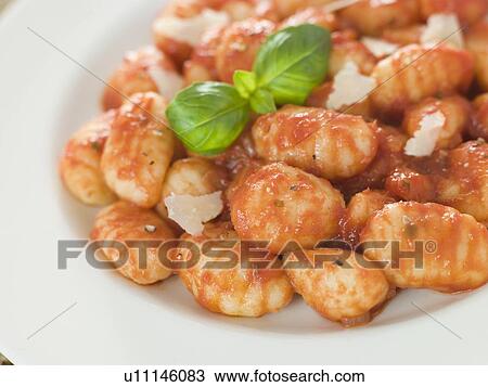 Stock Image - Potato Gnocchi with Tomato Ragu. Fotosearch