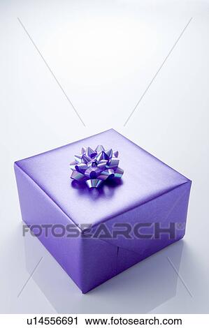 Present Wrapped In Purple Paper View Large Photo Image Stock Image - Present Wrapped In Purple Paper. Fotosearch