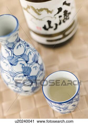 Stock Image - Sake Bottle Jug and Cup . Fotosearch