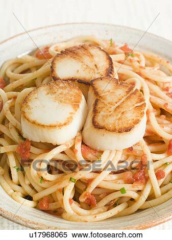 Seared Scallops with Chilli and Tomato Spaghetti View Large Photo Image Stock Photography - Seared Scallops with Chilli and Tomato Spaghetti. Fotosearch