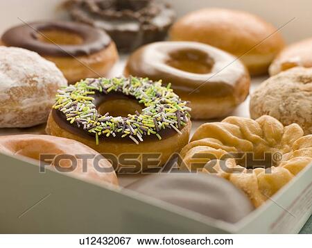 Stock Photo - Selection Of Doughnuts In A Tray. Fotosearch