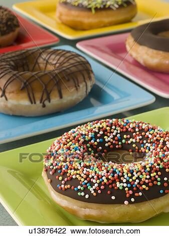 Selection Of Ring Doughnuts On A Different Coloured Plates View Large Photo Image Stock Image - Selection Of Ring Doughnuts On A Different Coloured Plates. Fotosearch