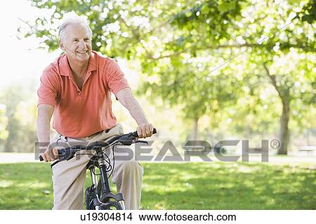 Picture - Senior man on a bicycle. Fotosearch