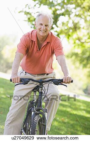 Stock Photo - Senior man on a bicycle. Fotosearch