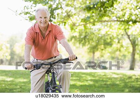 Stock Photography - Senior man on a bicycle. Fotosearch