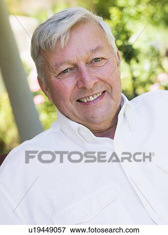 Senior man sitting outdoors View Large Photo Image Stock Photo - Senior man sitting outdoors. Fotosearch
