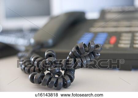 Shot of a telephone cord View Large Photo Image Stock Photo - Shot of a telephone cord. Fotosearch