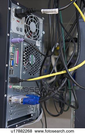 Stock Photo - Shot of many cables in the back of a computer modem. Fotosearch