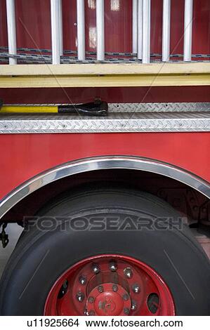 Side view of a fire engine with ladder View Large Photo Image Picture - Side view of a fire engine with ladder. Fotosearch