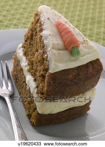 Stock Image - Slice Of American Carrot Cake On A Plate With A Fork. Fotosearch