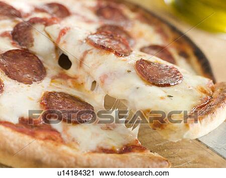 Stock Image - Slice of Pepperoni Pizza. Fotosearch