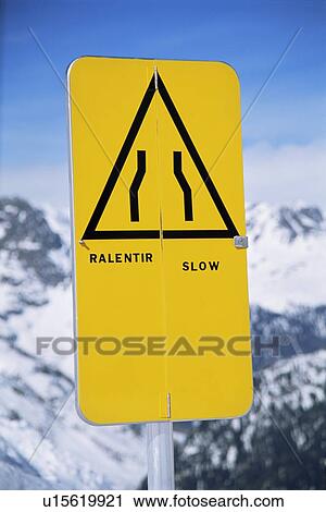 Slow sign on snowy mountain (selective focus) View Large Photo Image Stock Image - Slow sign on snowy mountain (selective focus). Fotosearch