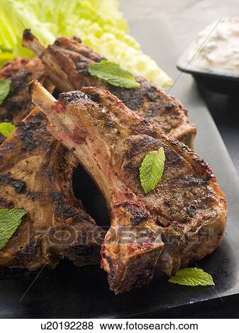 Stock Photo - Spiced Lamb Chops with Raita - Chaamp Lajawab. Fotosearch