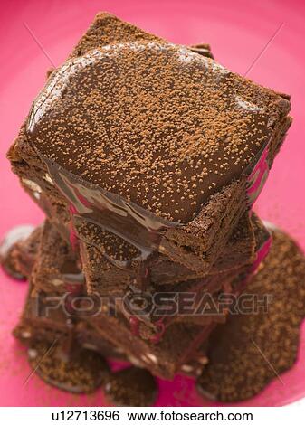 Stack Of Chocolate Brownies With Chocolate Fudge Sauce View Large Photo Image Stock Photograph - Stack Of Chocolate Brownies With Chocolate Fudge Sauce. Fotosearch