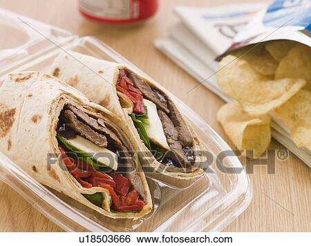 Steak, Cheese, Red Pepper And Barbeque Sauce Tortilla Wrap With A Can Of Cola And Packet Of Crisps View Large Photo Image Stock Photograph - Steak, Cheese, Red Pepper And Barbeque Sauce Tortilla Wrap With A Can Of Cola And Packet Of Crisps. Fotosearch