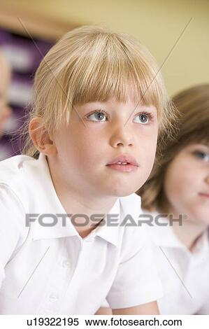 Student in class paying attention (selective focus) View Large Photo Image Stock Photography - Student in class paying attention (selective focus). Fotosearch