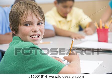 Students in class writing (selective focus) View Large Photo Image Picture - Students in class writing (selective focus). Fotosearch
