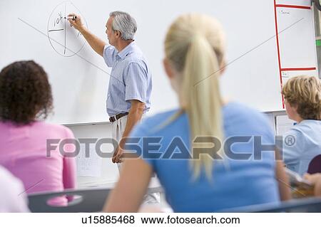 Stock Photo - Students in math class with teacher. Fotosearch