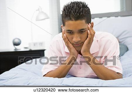 Teenage Boy Lying On Bed View Large Photo Image Stock Image - Teenage Boy Lying On Bed. Fotosearch