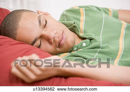 Teenage Boy Lying On Bed View Large Photo Image Stock Image - Teenage Boy Lying On Bed. Fotosearch