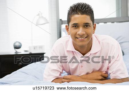 Teenage Boy Lying On Bed View Large Photo Image Stock Image - Teenage Boy Lying On Bed. Fotosearch