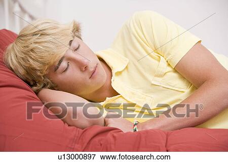 Teenage Boy Lying On Bed View Large Photo Image Stock Photo - Teenage Boy Lying On Bed. Fotosearch