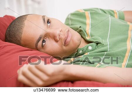 Teenage Boy Lying On Bed View Large Photo Image Stock Photo - Teenage Boy Lying On Bed. Fotosearch