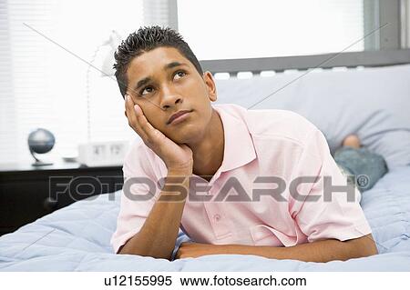 Teenage Boy Lying On Bed View Large Photo Image Stock Photography - Teenage Boy Lying On Bed. Fotosearch