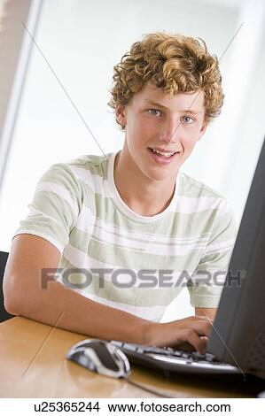 Teenage Boy Using Desktop Computer View Large Photo Image Picture - Teenage Boy Using Desktop Computer. Fotosearch