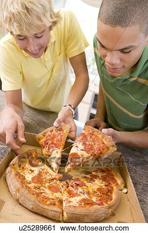 Teenage Boys Eating Pizza View Large Photo Image Stock Image - Teenage Boys Eating Pizza . Fotosearch