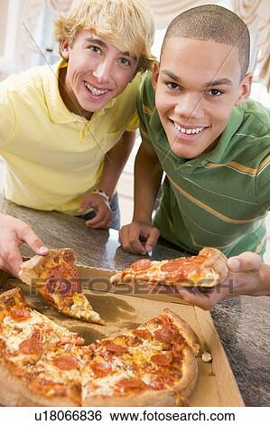 Teenage Boys Eating Pizza View Large Photo Image Stock Photograph - Teenage Boys Eating Pizza . Fotosearch