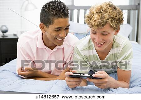 Stock Photo - Teenage Boys Playing Video Games. Fotosearch