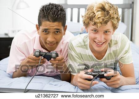 Stock Photo - Teenage Boys Playing Video Games. Fotosearch