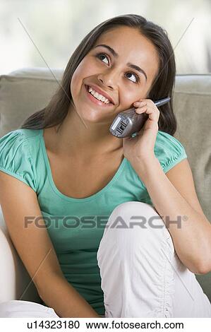 Stock Image - Teenage Girl Chatting On Telephone. Fotosearch