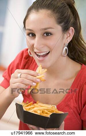 Teenage Girl Eating French Fries View Large Photo Image Stock Photograph - Teenage Girl Eating French Fries . Fotosearch