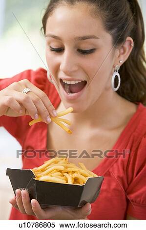 Teenage Girl Eating French Fries View Large Photo Image Stock Photography - Teenage Girl Eating French Fries . Fotosearch