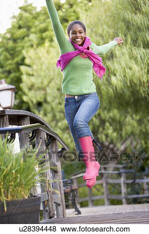 Teenage Girl Frolicking Outdoors View Large Photo Image Stock Photo - Teenage Girl Frolicking Outdoors. Fotosearch