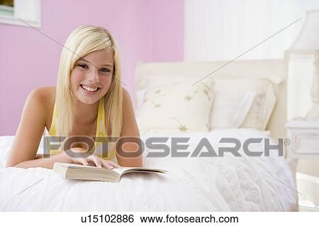 Teenage Girl Lying On Bed Reading View Large Photo Image Stock Photograph - Teenage Girl Lying On Bed Reading. Fotosearch