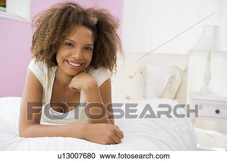 Teenage Girl Lying On Bed View Large Photo Image Stock Image - Teenage Girl Lying On Bed. Fotosearch