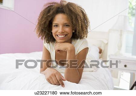 Teenage Girl Lying On Bed View Large Photo Image Stock Image - Teenage Girl Lying On Bed. Fotosearch