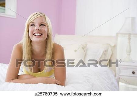 Teenage Girl Lying On Bed View Large Photo Image Stock Photography - Teenage Girl Lying On Bed. Fotosearch