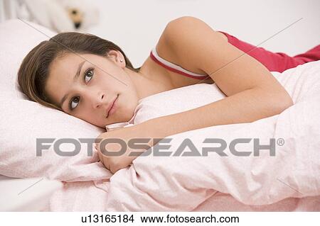 Teenage Girl Lying On Her Bed Looking Sick View Large Photo Image Picture - Teenage Girl Lying On Her Bed Looking Sick . Fotosearch