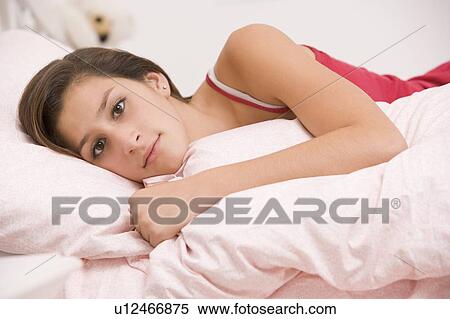 Teenage Girl Lying On Her Bed Looking Sick View Large Photo Image Stock Photography - Teenage Girl Lying On Her Bed Looking Sick . Fotosearch