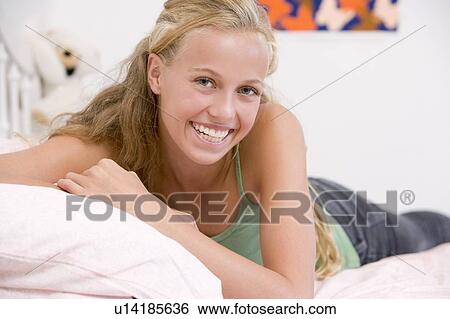 Teenage Girl Lying On Her Bed View Large Photo Image Stock Photograph - Teenage Girl Lying On Her Bed . Fotosearch
