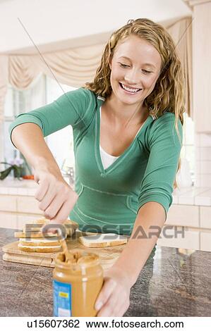 Teenage Girl Making Peanut Butter Sandwich View Large Photo Image Stock Image - Teenage Girl Making Peanut Butter Sandwich. Fotosearch